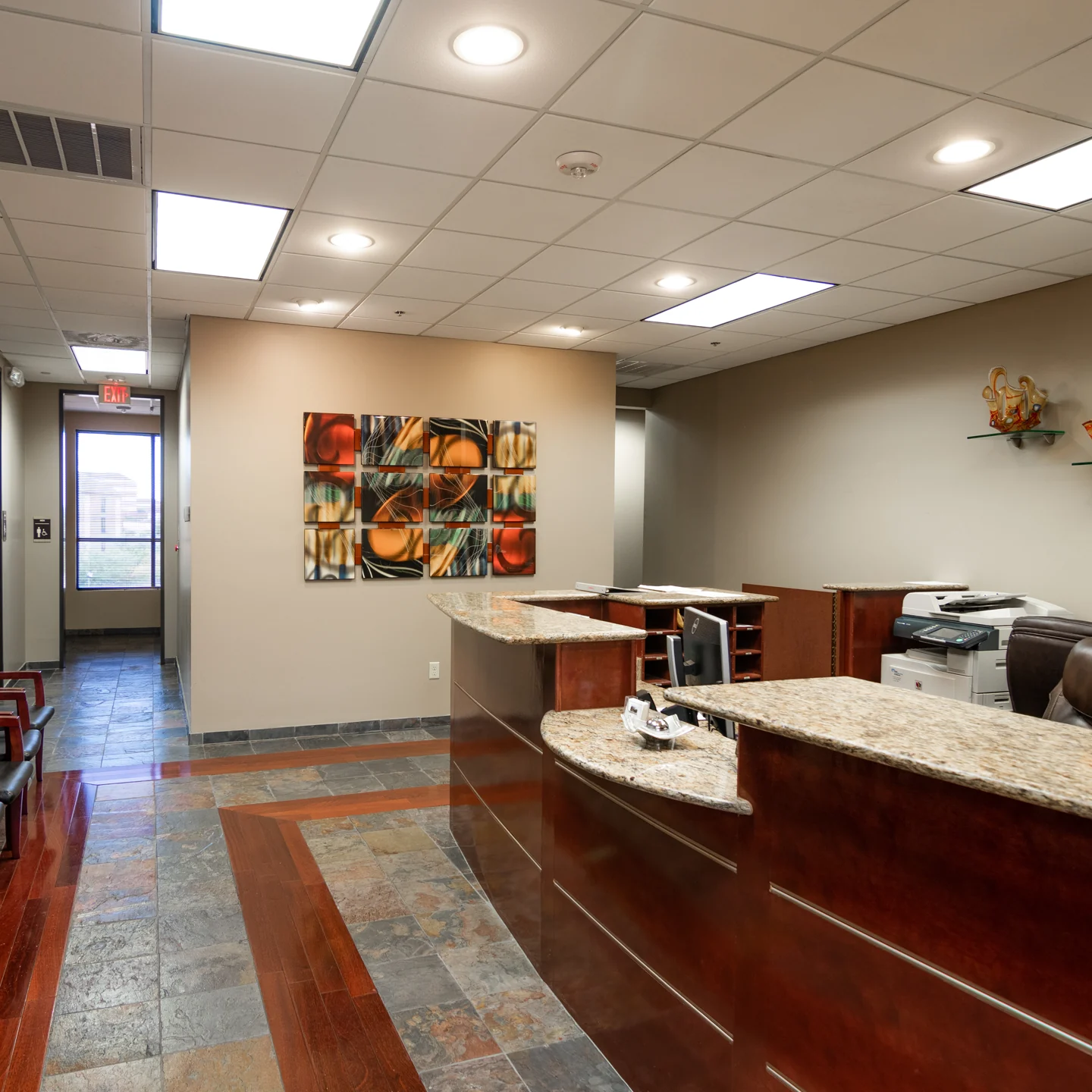 Sugarcreek reception desk with chairs for arriving visitors